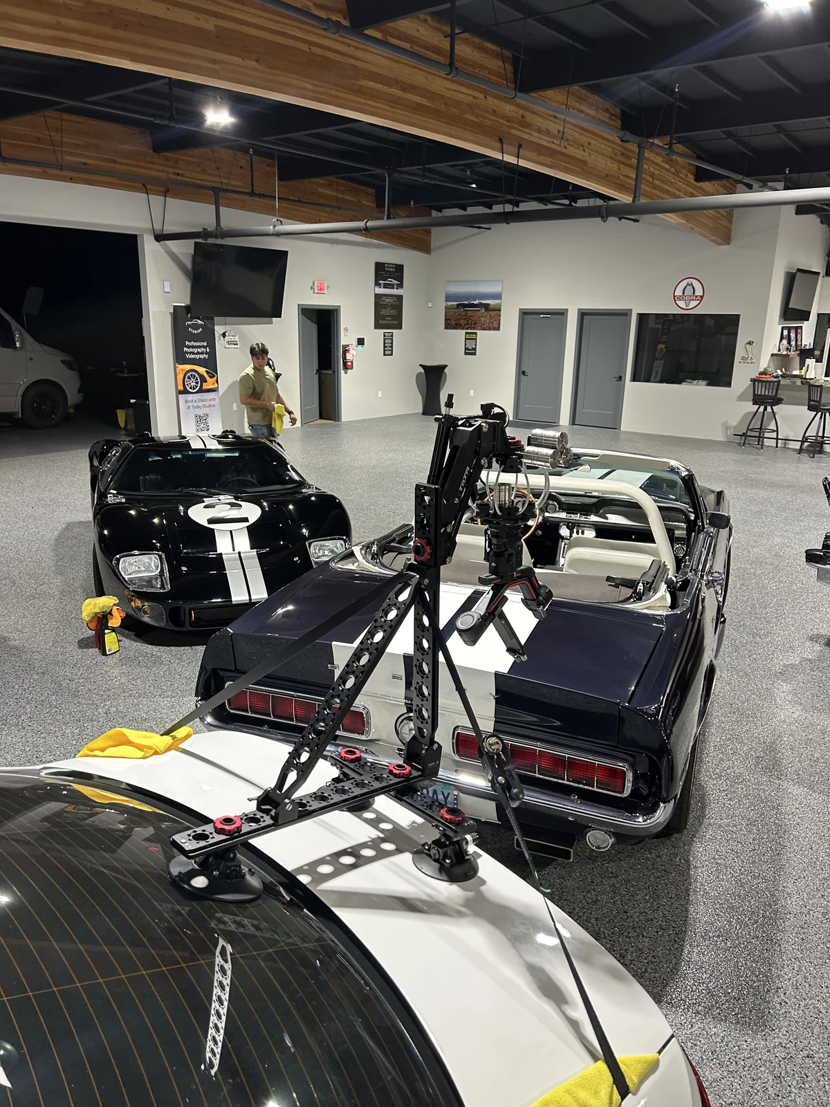 A camera car mount rigged on a classic Shelby, with a Ford GT behind